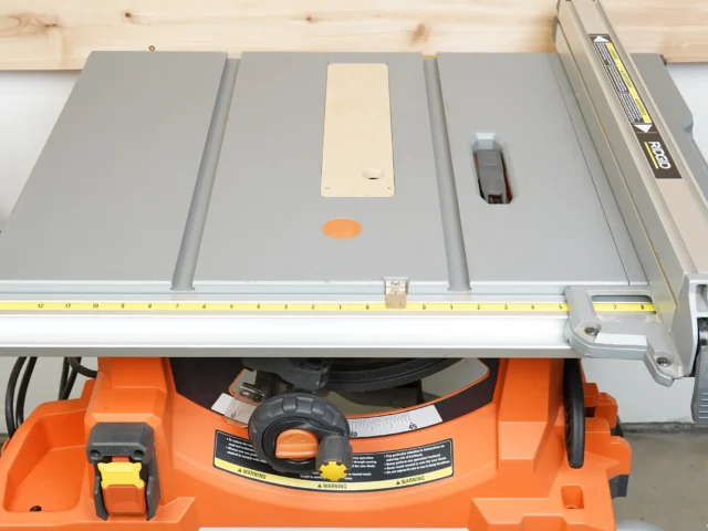 Zero clearance insert installed on Ridgid R4513 table saw, showing cream-colored MDF insert flush with gray aluminum table surface and blade opening