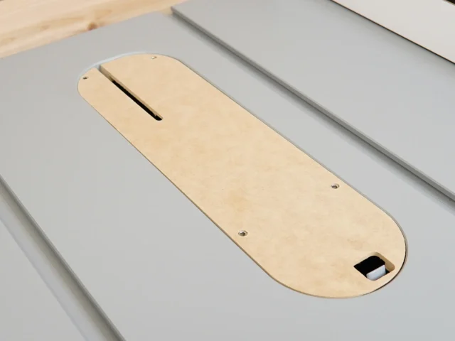 Natural wood zero clearance insert for SawStop Jobsite PRO table saw, showing slot for blade, mounting holes, and adjustment port at bottom
