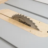 MDF zero clearance insert seated in a SawStop Jobsite PRO table saw with the blade raised through the slot