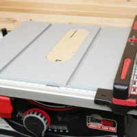 Cream-colored MDF zero clearance insert mounted on SawStop Jobsite PRO table saw, fitted flush with saw surface