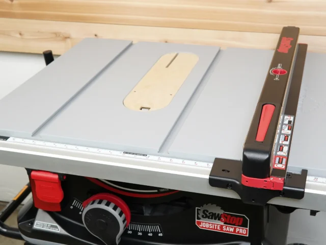 Cream-colored MDF zero clearance insert mounted on SawStop Jobsite PRO table saw, fitted flush with saw surface