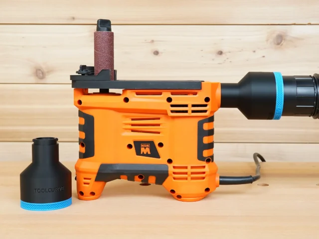 Black 2-1/2 inch hose adapter with blue band shown beside and installed on an orange WEN handheld spindle sander