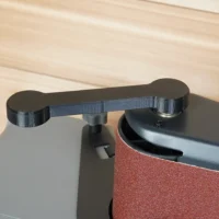 Black PETG wrench with curved ends mounted over adjustment knob on Ridgid oscillating sander