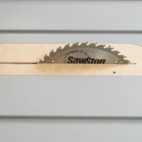 Light wood zero clearance insert for SawStop table saw with sawblade cutout and mounting holes
