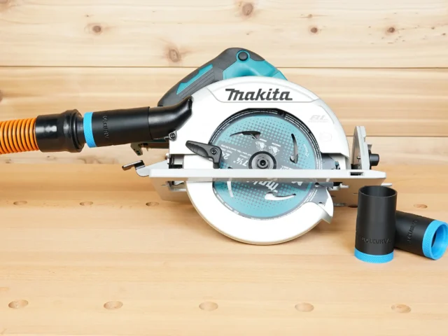 Black 1-1/4" ToolCurve hose adapter linking an orange hose to a Makita 7-1/4" circular saw, spare adapters beside