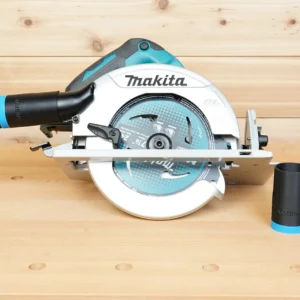 Black ToolCurve hose adapter with blue band linking a vacuum hose to a Makita cordless circular saw, two spare adapters beside it