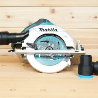 Black ToolCurve 1-7/8 inch hose adapter with blue trim installed on a Makita cordless circular saw, plus two loose adapters