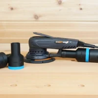 Black ToolCurve 36mm hose adapter with blue rings shown loose and installed on a MAXXT sander dust port