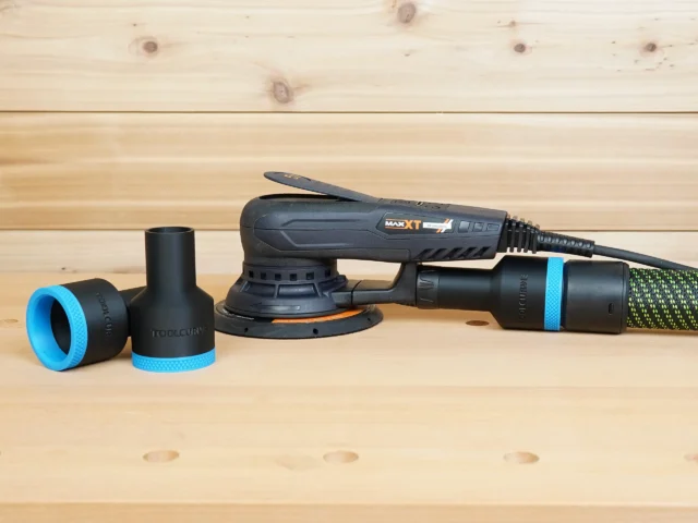 Black ToolCurve 36mm hose adapter with blue rings shown loose and installed on a MAXXT sander dust port