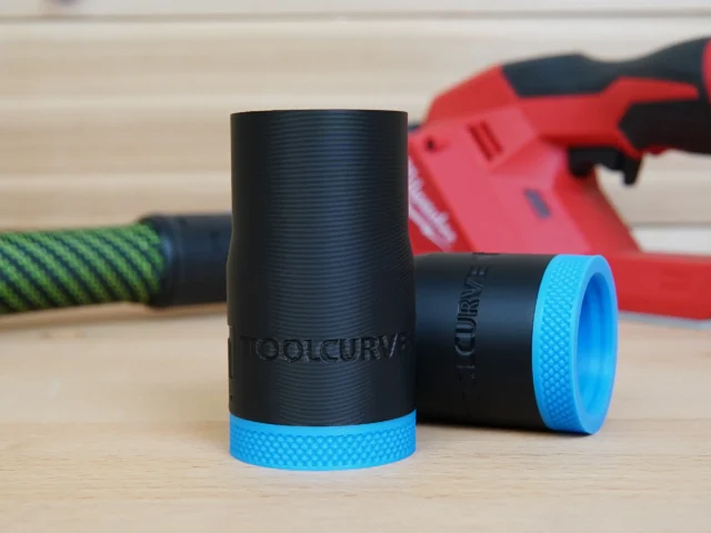 Black hose adapter with blue grip ring, labeled ToolCurve, displayed standalone alongside similar adapters and a red Milwaukee cordless planer