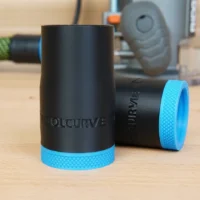 Black ToolCurve hose adapter with blue grip ring for Ridgid 2 HP router, shown standalone and installed on router in background