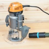 Hose adapter attached to orange and gray Ridgid 2 HP router with 27mm Festool hose connected