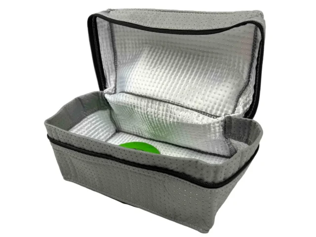 Gray polyester reusable dust bag with black zipper and silver reflective inner lining, shown open with a green object inside
