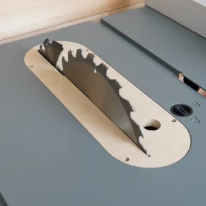 MDF zero clearance insert seated in a gray Craftsman CMX table saw with blade raised through the slot