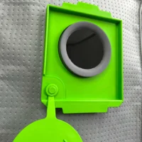 Bright green reusable filter bag for Festool CT 48 dust extractor, shown from front with gray collar opening and lower handle attachment