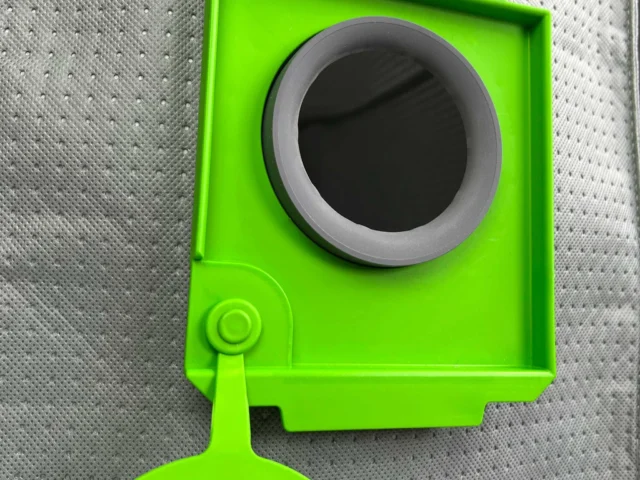 Bright green reusable filter bag for Festool CT 48 dust extractor, shown from front with gray collar opening and lower handle attachment