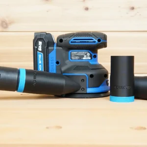 Black ToolCurve hose adapters with blue rings, one joined to a hose, beside a Kreg random orbit sander