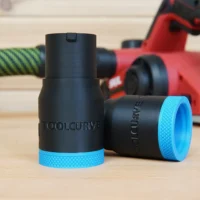 Black and blue hose adapter for SKIL 3.25 in planer with textured blue grip rings on both ends, displayed alongside a red planer and green hose