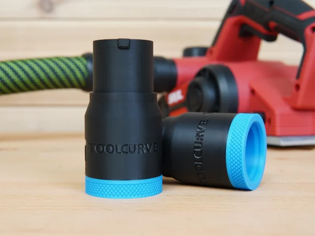 Black and blue hose adapter for SKIL 3.25 in planer with textured blue grip rings on both ends, displayed alongside a red planer and green hose