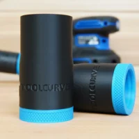 Black ToolCurve hose adapter with blue textured grip band, shown with matching adapters and Kreg sander in background