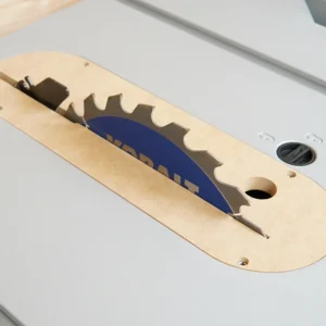 MDF zero clearance insert seated in a Kobalt 10-inch table saw with the blade raised through its slot