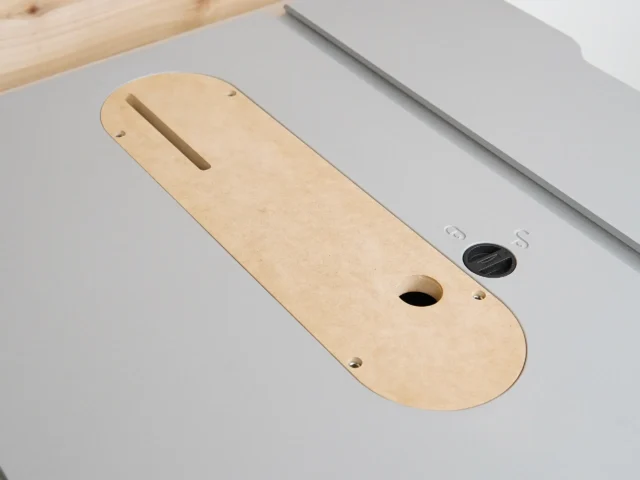 MDF zero clearance insert for Kobalt 10″ table saw, shown from above with slot and circular opening visible