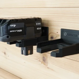 Two black Ryobi 18V battery mounts screwed to a pine wall, one holding a 4Ah battery, one empty