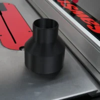 Black tapered hose adapter standing on a table saw, positioned near the rear dust port area next to a red track rail