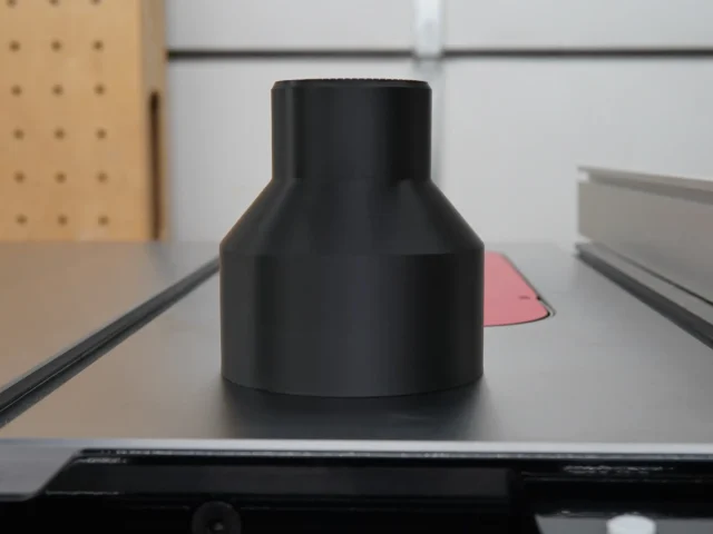 Black hose adapter for SawStop 4" rear dust port, shown standalone with conical shape and top opening