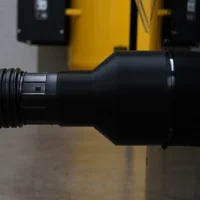 Black hose adapter with threaded inlet and elbow outlet, shown from the side in profile