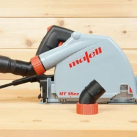 No Snag Dust Port adapter installed on Mafell MT 55cc track saw, with hose attached angled upward to prevent snagging