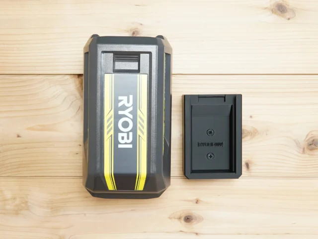 Ryobi 40v battery mount shown next to Ryobi 40v battery for size comparison on wooden surface