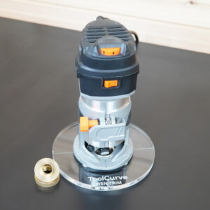 Clear 6 inch round acrylic router base, guide bushing version, mounted on a Wen trim router beside a brass threaded bushing ring