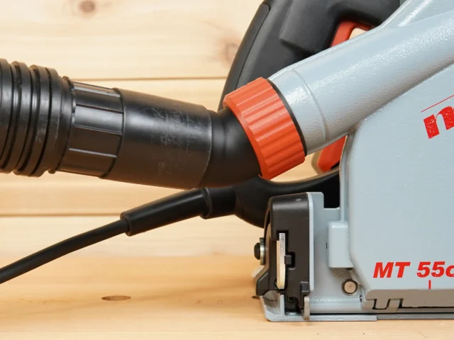 No-Snag Dust Port adapter with orange grip collar attached to Mafell track saw dust port, black hose connected below