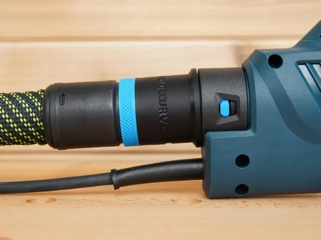 Hose adapter attached to Bosch drywall sander dust port, with 27mm Festool hose and blue identification band