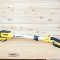 Dewalt 20v Max 9in drywall sander on a workbench with a 1-7/8 inch hose adapter fitted to its dust port