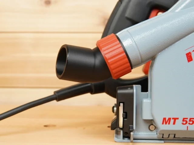 No Snag Dust Port adapter attached to Mafell track saw, angling black hose upward with red grip collar