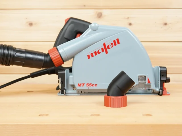ToolCurve No Snag Dust Port Adapter attached to a Mafell MT 55cc track saw, with hose connected and angled upward