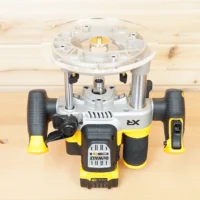 8-inch round acrylic router base plate mounted on a DeWalt 2-1/4 HP cordless router, viewed from above on a wood surface