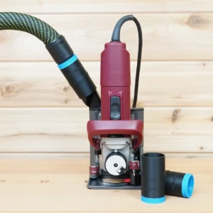 Black 27mm hose adapter with blue ring connecting a vacuum hose to a Lamello Zeta P2 joiner, spare adapters beside it