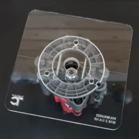 Clear acrylic 10-inch base plate for Milwaukee M18 2-1/4 HP router, shown from above with concentric circles and mounting holes visible