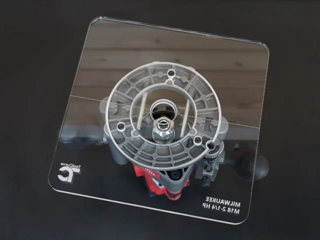 Clear acrylic 10-inch base plate for Milwaukee M18 2-1/4 HP router, shown from above with concentric circles and mounting holes visible