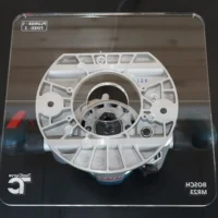 Clear acrylic 10" square router base plate for Bosch MR23EVS, mounted on router showing wide cut base design with central bit opening and mounting holes