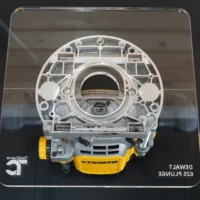 10-inch square clear acrylic router base plate mounted on a DeWalt 625 plunge router, front view showing circular opening and mounting hardware