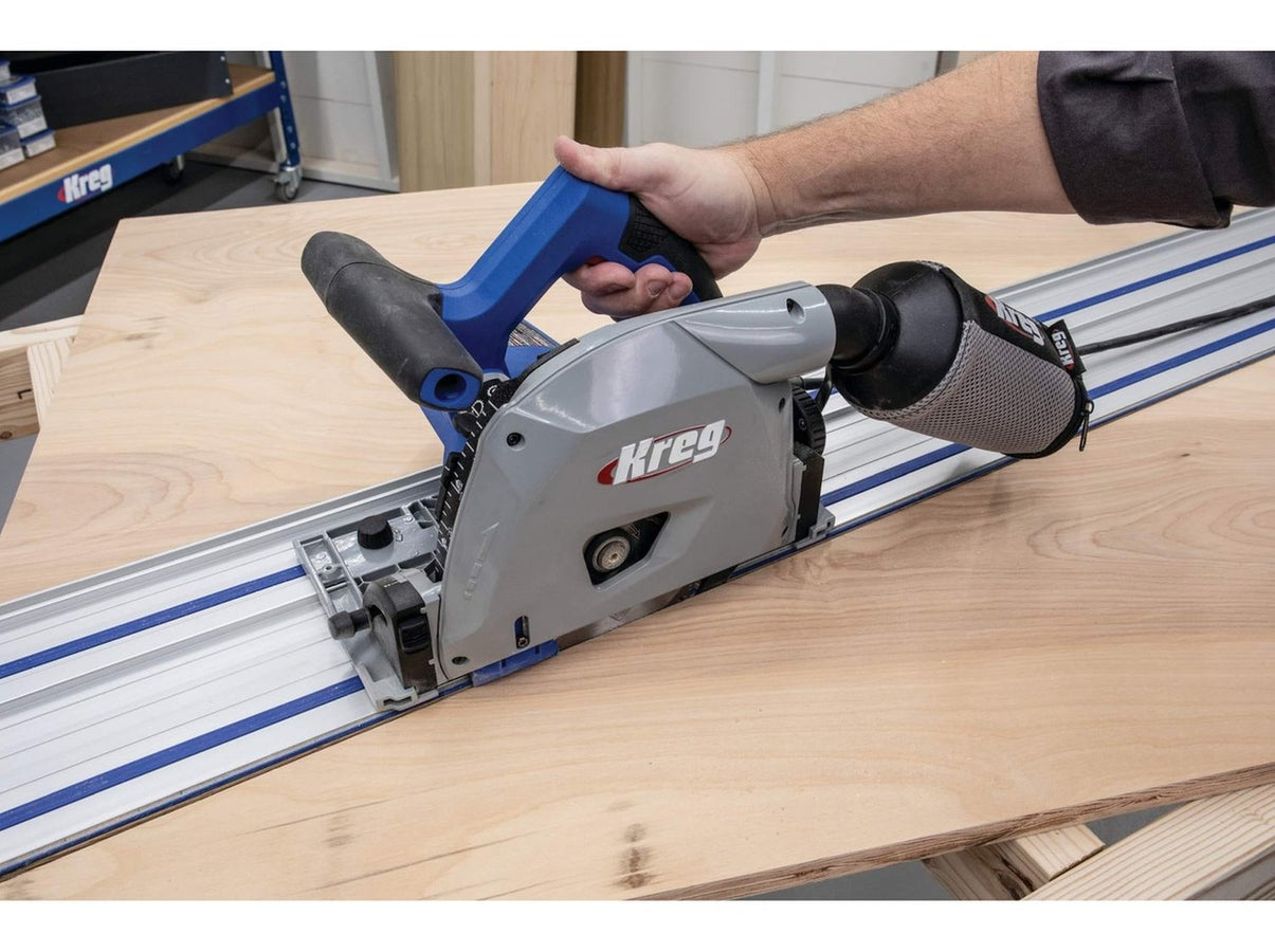 Kreg ACS plunge saw on a guide track with its dust bag connected behind the blade housing