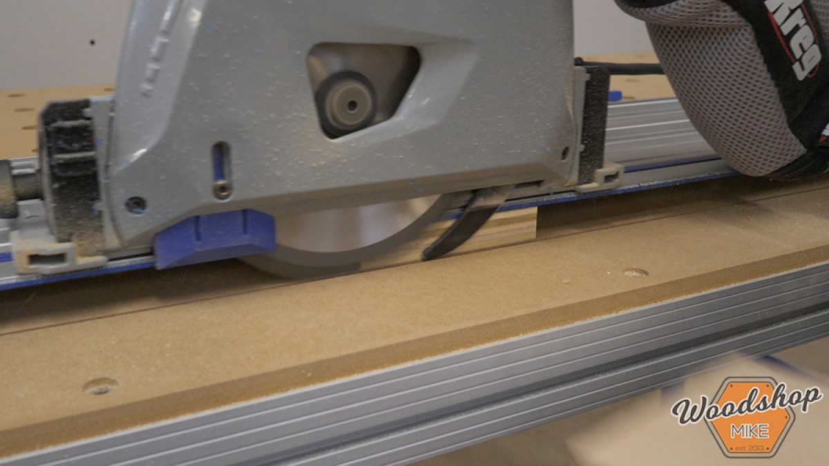 Kreg ACS plunge saw seated on its guide track during a workshop setup