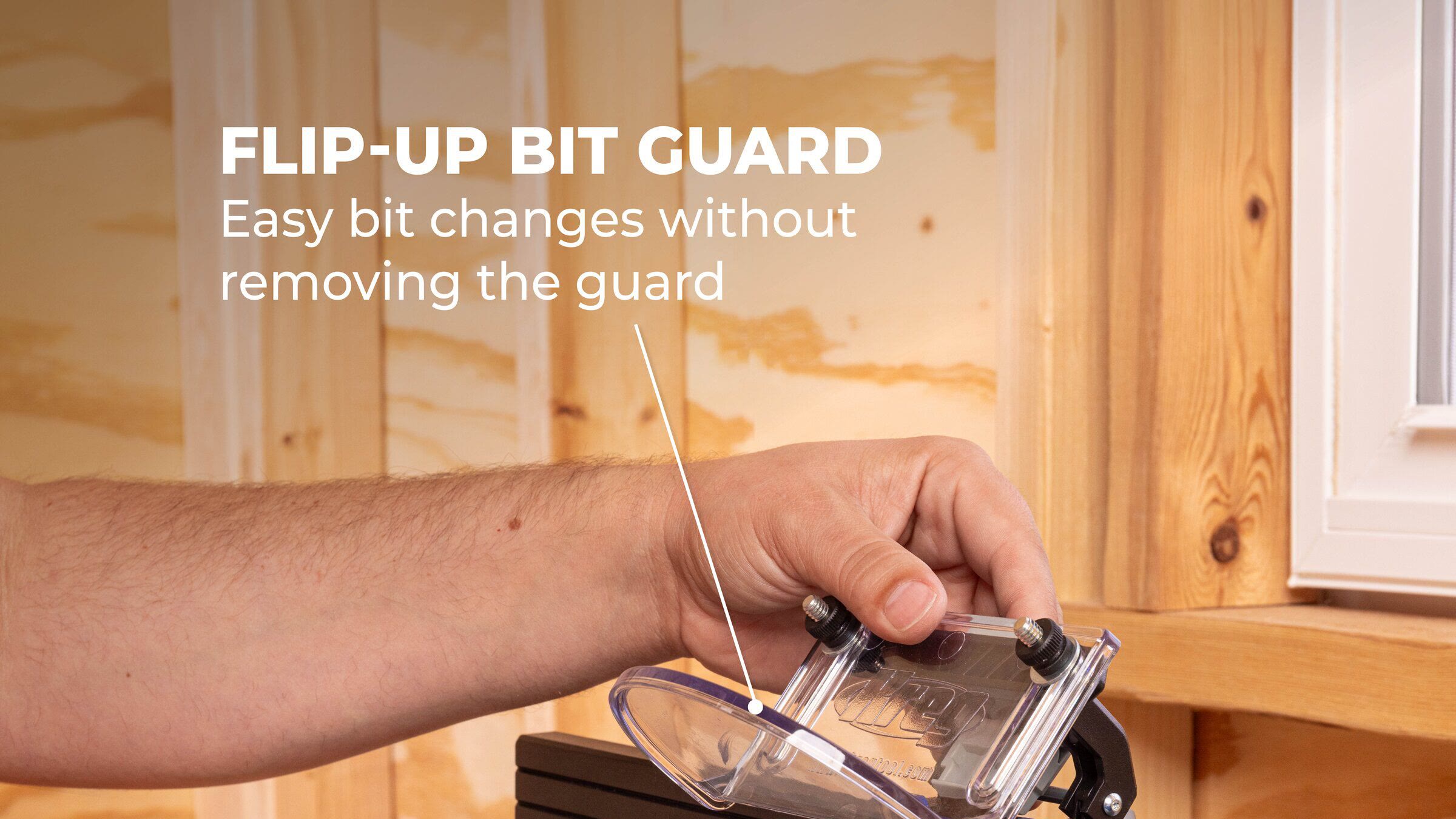 Kreg Dock & Go clear flip-up bit guard raised at its fence hinge for adjustment