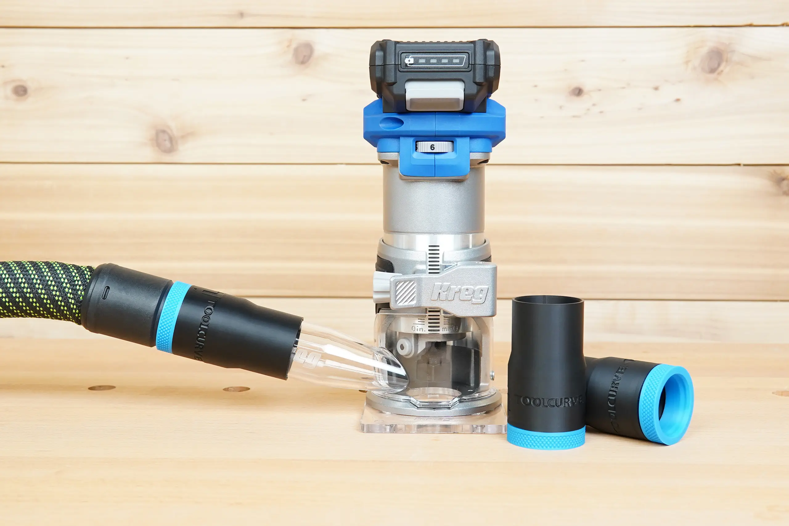 ToolCurve hose adapter connecting a braided dust-extractor hose to a Kreg 20V trim router