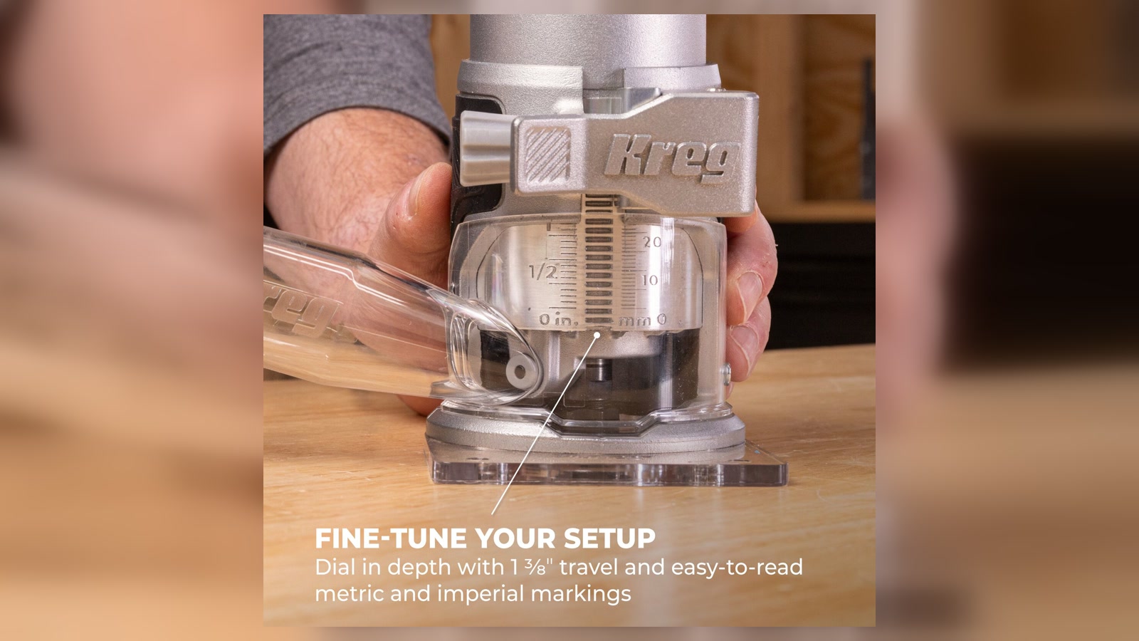 Close view of the Kreg PRSPR125 trim router depth scale, clear base, and dust adapter