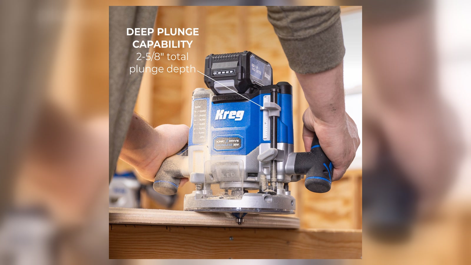 Kreg KPTBPR225B 20V plunge router being guided into a workpiece with both handles